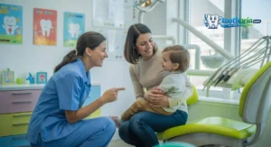 Pediatric dentist explaining fluoride treatment to a parent in a child-friendly dental clinic